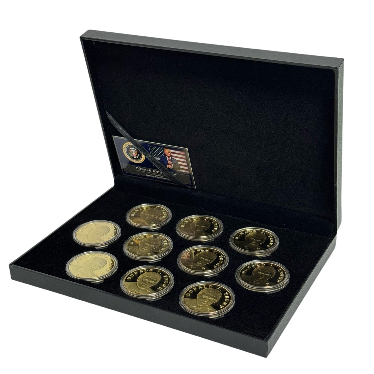 Open Trump Treasure Box with ten gold Trump coins and presidential certificate card, angled view