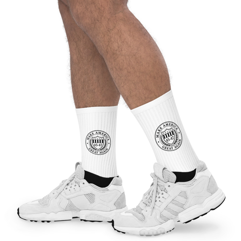 White Make America Great Again 45-47 crew socks with black seal logo, worn with sneakers