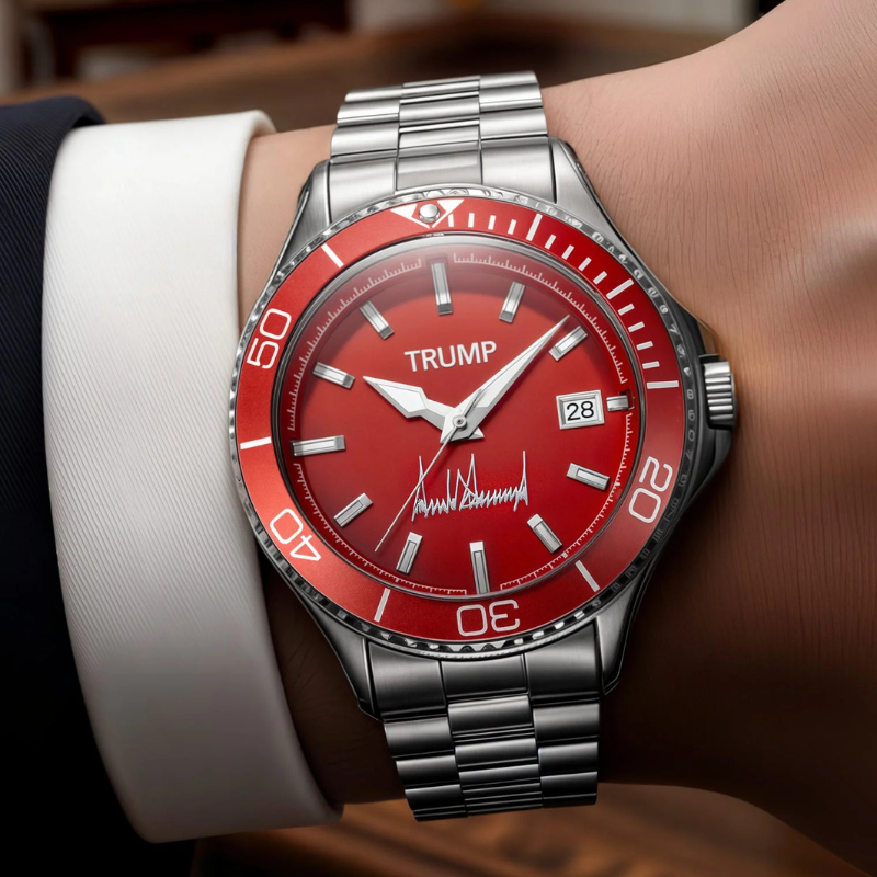 Trump red dial watch worn on wrist with suit cuff