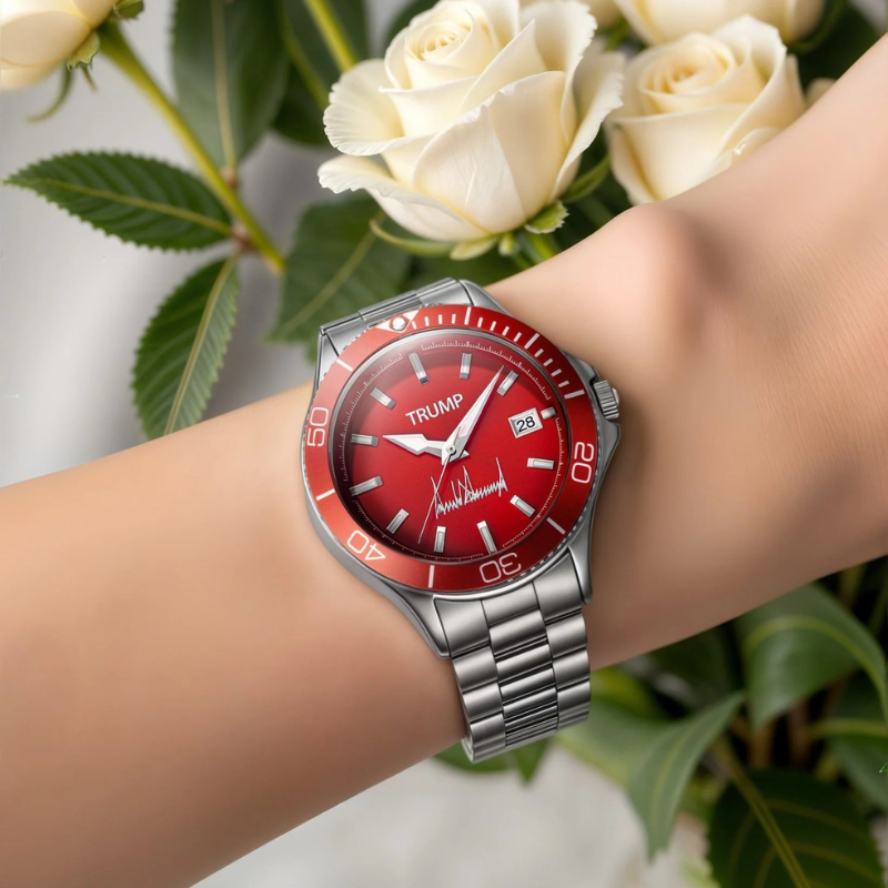 Trump red dial watch worn on wrist beside white roses