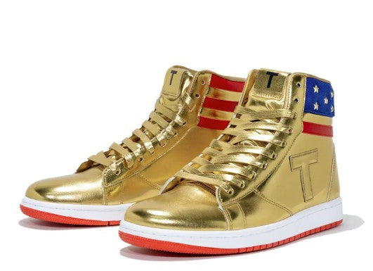 Gold Trump Never Surrender high-top sneakers, angled pair with American flag stars, stripes and T logo