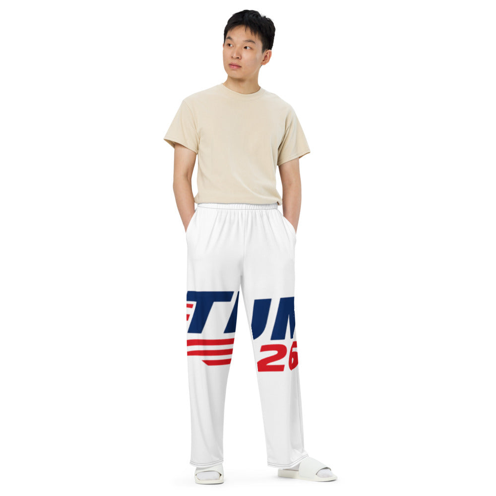 Man wearing Trump 2026 white wide-leg pants with red and navy print, full length front view