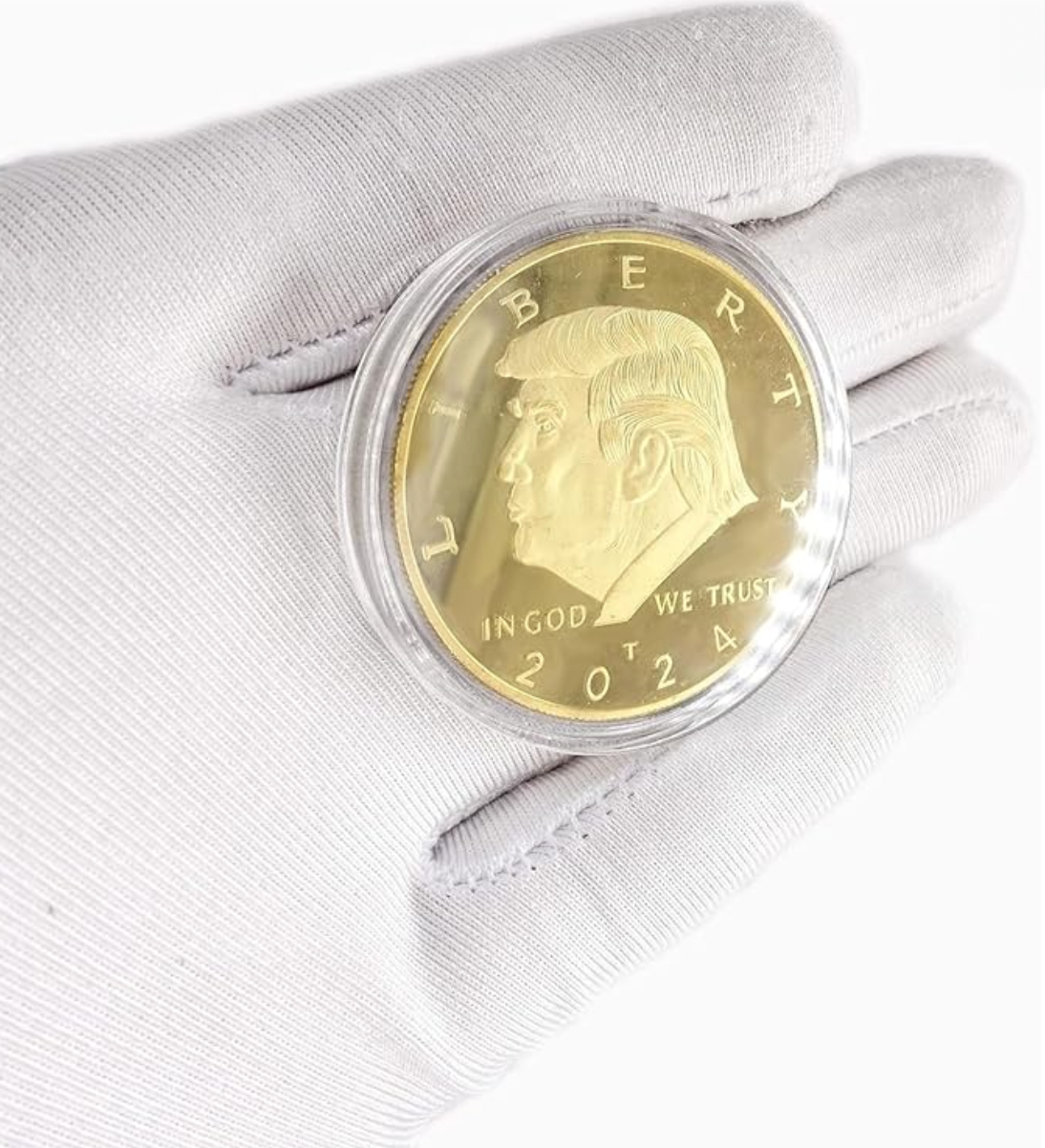 President Trump Liberty Gold Coin held in gloved hand, obverse profile with Liberty and In God We Trust 2024