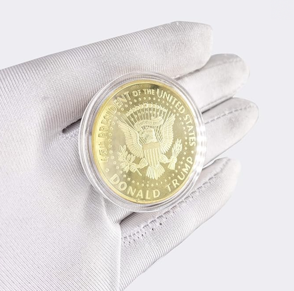 President Trump Liberty Gold Coin reverse in gloved hand, eagle with Donald Trump 45th President text