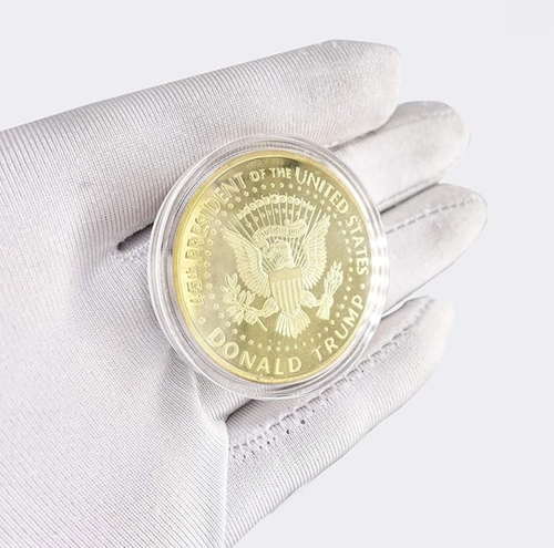 President Trump Liberty Gold Coin reverse in gloved hand, eagle with Donald Trump 45th President text