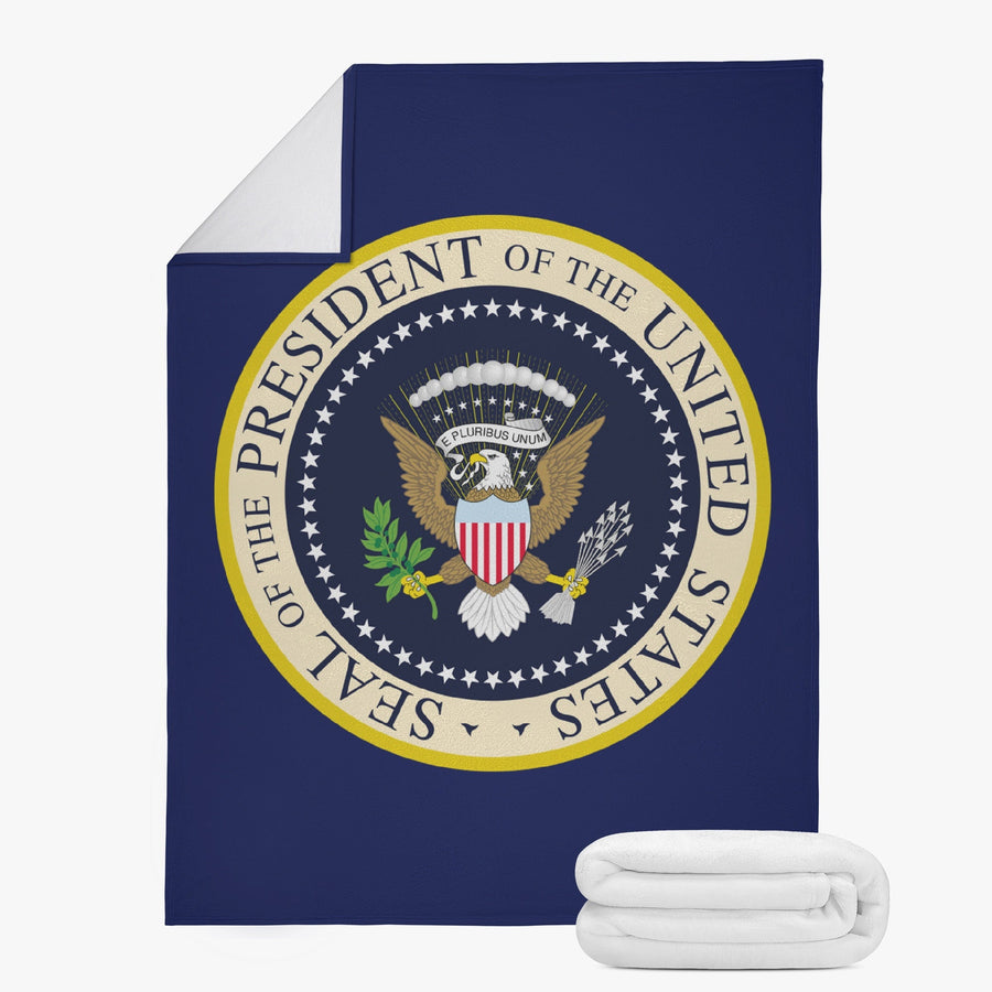 Navy Seal of the President blanket shown flat with folded white fleece back