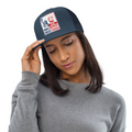 Woman wearing navy MAGA trucker cap with Make America Great Again Trump patch