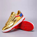Never Surrender gold low top sneakers with red trim, T logo and stars, red sole detail
