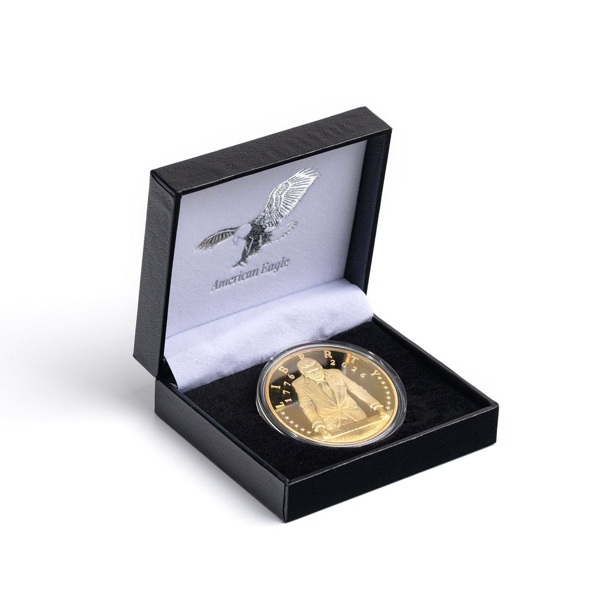 Gold Trump 2026 coin in black American Eagle presentation box, angled view