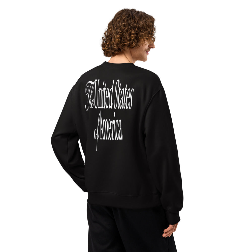 Man wearing black sweatshirt, back showing The United States of America script print
